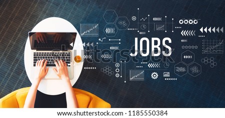 Jobs with person using a laptop on a white table