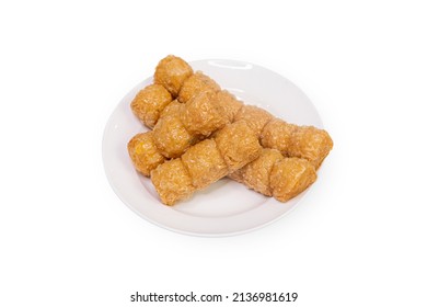 Jock fried chicken for a snack ready to serve in a white plate on a white background.