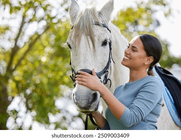 Jockey, woman and bonding with horse in countryside for companion, training and relax from practice in forest. Equestrian, person and stallion outdoor with pet care, smile and agriculture in nature - Powered by Shutterstock