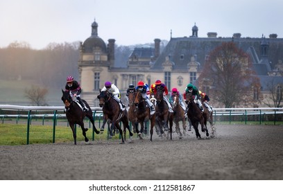 Jockeys During Horse Race On Their Horses Running Towards Finish Line.