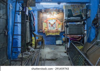 JODHPUR, INDIA - 17 FEBRUARY 2015: Empty Mechanics Shop With Small Shiva Temple In Background.