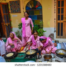 Jodhpur, India - Nov 6, 2017. Women cooking Indian traditional meal in Jodhpur, India. Jodhpur is the second largest city in state of Rajasthan.