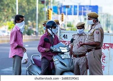 Jodhpur, Rajashtbn, India. 30 March 2020. Police stops citizen, commuters, lockdown to prevent the spread of new strain of coronavirus. Local Police checks vehicle during, omicron cases in india
