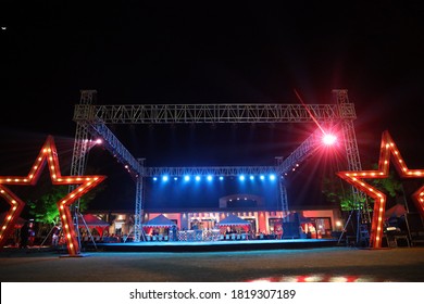 Jodhpur, Rajasthan, India, August 20th, 2020: Low Angle View Of Big Empty Dance Floor At A Outdoor Event With Big Star Illustration And Vivid Colorful Back Light, Empty Night Clubs Due To Covid-19