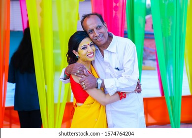 Jodhpur, Rajasthan, India - October 18th, 2019: Indian Hindu Bride With Turmeric Paste Applied On Her Face Having Fun Hug With Her Father, Fathers Day,  Indian Wedding Concept