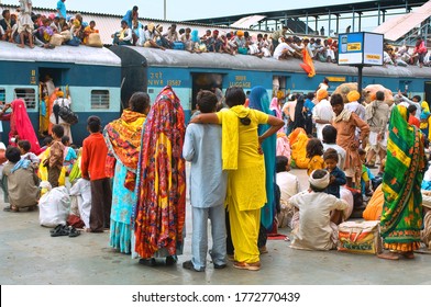 Jodhpur,30, October, 2011: Station Platform Full Of People Unable To Board 
Looking Surprisingly At The Train Over Crowded Up To Roof Top And Chaos Created By Passengers,Jodhpur, Rajasthan, India     