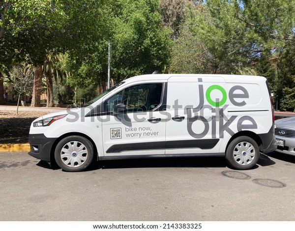 Joe Bike service van parked\
at a customer location. Side view - Palo Alto, California, USA -\
2022
