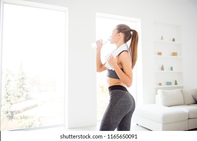 Jogger Run Runner Energy Sweaty Yoga Vitality Wellness Concept. Side Profile View Photo Portrait Of Sexual Attractive Beautiful Glad Sportive Woman Holding Bottle In Hand Standing In White Room