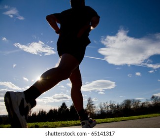 Jogger Running In Back Light