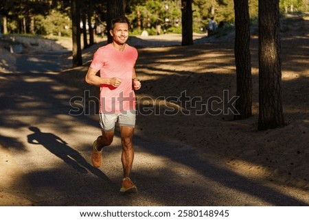 Jogging along a forested path during the golden hour in a tranquil outdoor setting