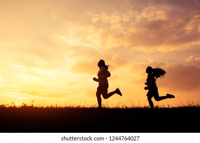 Silhouette Young Couple Running Together On Stock Photo 2119486052 ...