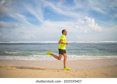 Jogging on a tropical sandy beach near sea / ocean. - Powered by Shutterstock