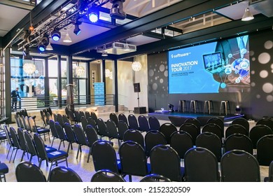 JOHA, SOUTH AFRICA - Mar 26, 2022: An Interior Of A Conference Event Venue With Blue Chairs And A Screen Showing A Presentation