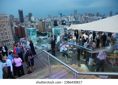 Johannesburg Gauteng South Africa 02 07 2011 Rooftop Party With City Scape At Back At Sunset 