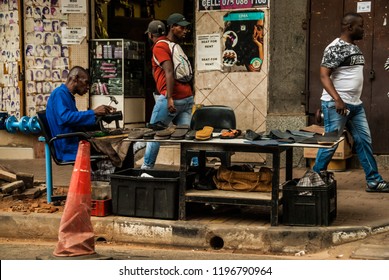 Johannesburg, Gauteng / South Africa - October 03 2018 : Street Shoe Repair Done By Man On The Sidewalk Morning Johannesburg City CBD