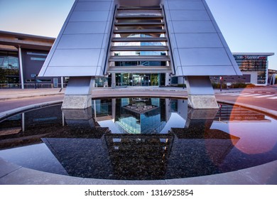 Johannesburg, South Africa, 18th February - 2019: Exterior Of Modern Corporate Office Building With Water Feature In Foreground.