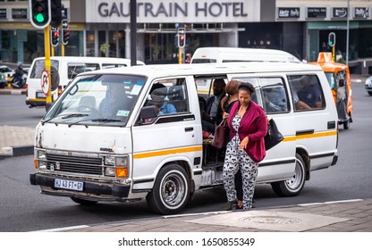 Johannesburg, South Africa 18th February - 2020: Commuter Getting Out Of Minibus Taxi.