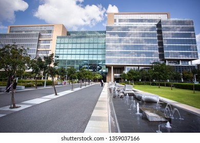 Johannesburg, South Africa, 22nd March- 2019: Exterior View Of Modern Office Building With Glass Facade. Water Feature In Foreground.