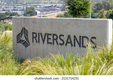 Johannesburg, South Africa, 24th February - 2022: Cement Signage Of New Large Industrial Development With Warehouses In Background.