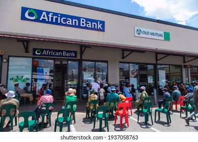 Johannesburg, South Africa - 3rd March, 2021: People Waiting Outside Bank For Government Grant Payment.