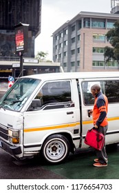 Johannesburg, South Africa,  7 September - 2018: Mini Bus Taxi With Passenger Climbing Out.