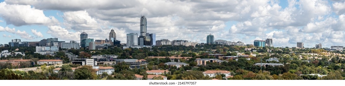 Johannesburg, South Africa - April 13, 2022 - Large Panoramic View Of Sandton City Skylines, The Leonardo Building, The Marc Mall And Momentum Building