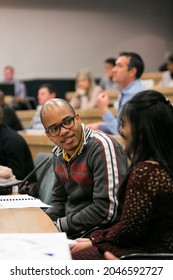 JOHANNESBURG, SOUTH AFRICA - Aug 11, 2021: A Vertical Shot Of Diverse Adult Delegates Attending A Business Lecture In A Classroom In Johannesburg, South Africa