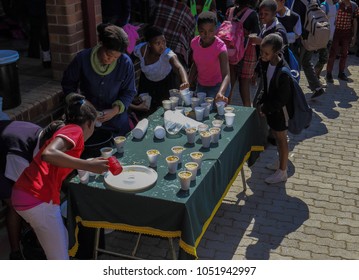 Johannesburg, South Africa - August 11, 2017: Unidentified Underprivileged School Children Receive Food Handouts At A Soup Kitchen At Their School In The City Image In Landscape Format