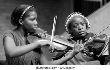 Johannesburg, South Africa - August 28 2010: Diverse youth at music school orchestra