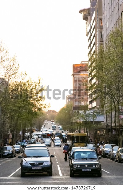 Johannesburg, South Africa - August 29 2013: Street\
scenes of Braamfontein Suburb of Johannesburg CBD during afternoon\
rush hour