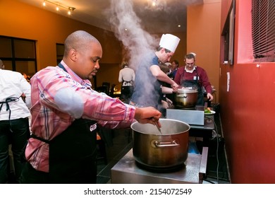 Johannesburg, south Africa - August 31, 2014: Diverse people at team building cooking class