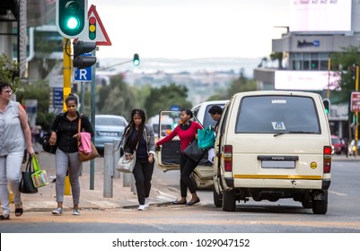 Johannesburg, South Africa -February 15, 2018:
People Getting Out Of A Taxi In The City Center