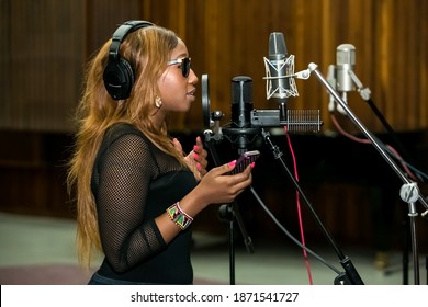 Johannesburg, South Africa - February 17, 2014: African Artist Victoria Kimani, Kenya Singing In A SABC Recording Studio