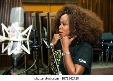 Johannesburg, South Africa - February 17, 2014: African Artist Omawumi, Nigeria Singing In A SABC Recording Studio