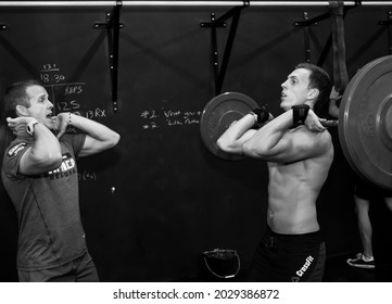 JOHANNESBURG, SOUTH AFRICA - Jan 05, 2021: The Personal Trainer Giving Fitness Instruction At A Crossfit Group Class In Johannesburg