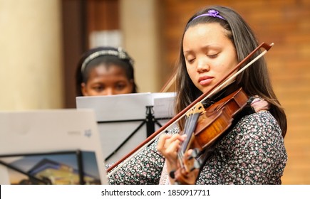 JOHANNESBURG, SOUTH AFRICA - Jan 23, 2019: Johannesburg, South Africa - August 28 2010: Diverse youth at music school orchestra