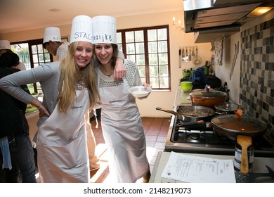 Johannesburg, South Africa - June 10, 2015: Diverse young people at team building cooking class