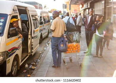 Johannesburg, South Africa - June 7, 2018: Street Vendor Selling Oranges At A Taxi Rank.