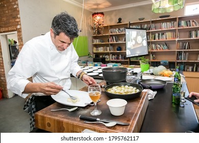 Johannesburg, South Africa - June 7, 2014: Chef Plating Up Food At Cooking Class For Beer And Food Pairing