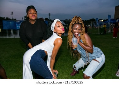 JOHANNESBURG, SOUTH AFRICA - Mar 25, 2022: A Group Of African Women Posing For A Fun Photoshoot Outside In The Evening