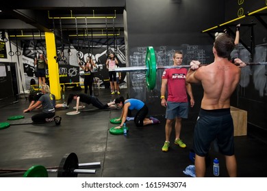 Johannesburg, South Africa - March 11, 2013: Personal Trainer Giving Fitness Instruction At A Crossfit Group Class