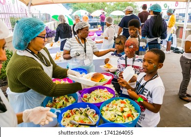 Johannesburg, South Africa - March 24, 2018: Soup Kitchen Community Outreach Catering Staff Dishing Up Meals For African Children