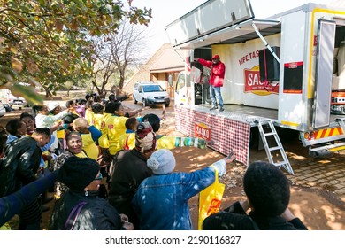 Johannesburg, South Africa - May 27, 2016: African Community Members Outside Town Hall Meeting