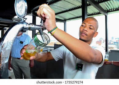 Johannesburg, South Africa - November 23, 2010: African Barman Pouring A Pint Draft Beer At Barman Training School