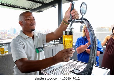 Johannesburg, South Africa - November 23, 2010: African Barman Pouring A Pint Draft Beer At Barman Training School