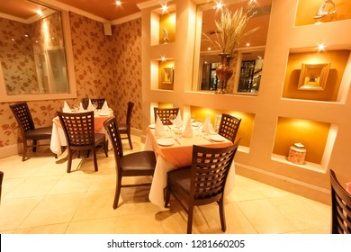 Johannesburg, South Africa - November 27 2008: Interior And Exterior Of Indian Restaurant