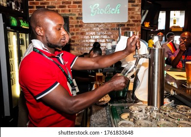 Johannesburg, South Africa - November 8, 2011: African Barman Pouring A Pint Draft Beer At Barman Training School