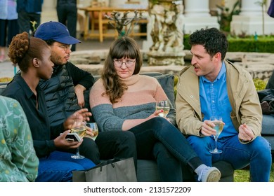 JOHANNESBURG, SOUTH AFRICA - Oct 25, 2021: A closeup shot of VIP guests mingling at outdoor social event