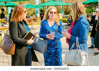 JOHANNESBURG, SOUTH AFRICA - Oct 25, 2021: A number of VIP guests mingling at an outdoor social event in Johannesburg, South Africa