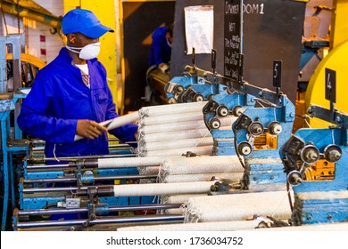 Johannesburg, South Africa - October 16, 2012: African Factory Worker On A Copwinder Weft Assembly Line Loom